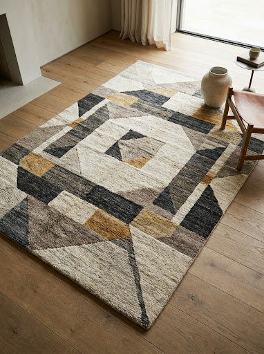 Contemporary handmade rug with a sophisticated geometric pattern in high-end interior
